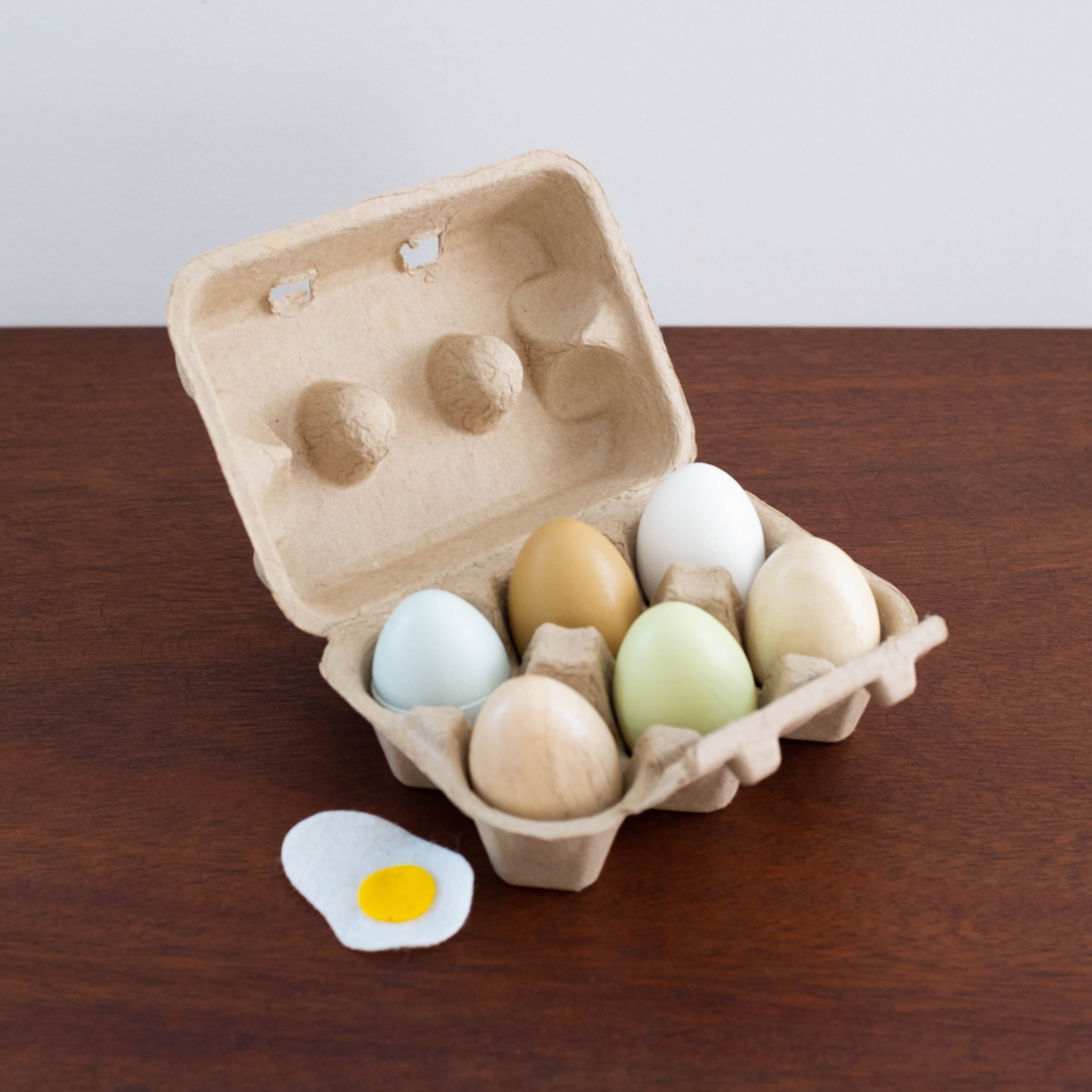 Wooden Eggs in a Carton